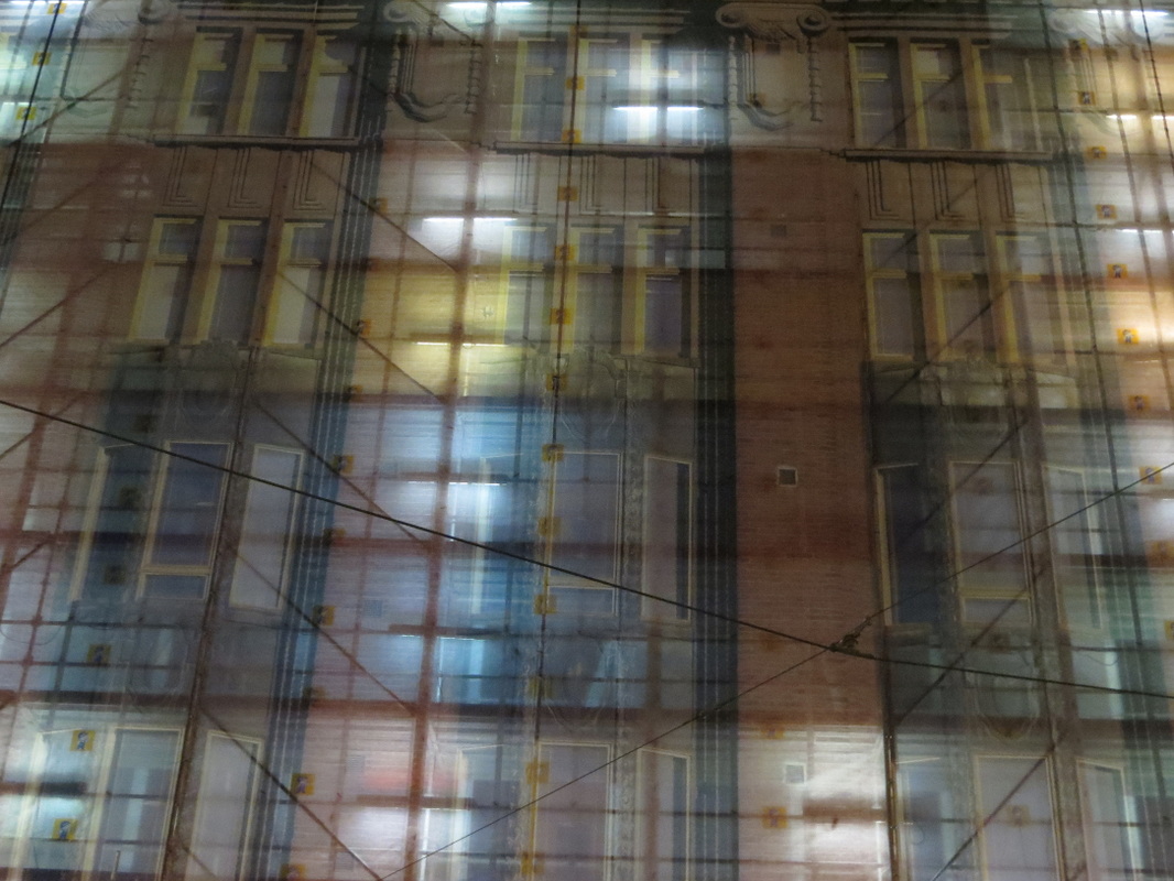 seethrough transparent facade city light shines through street photography
