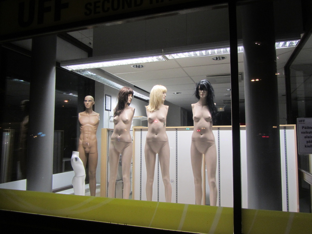 naked mannequins shop window city street photography