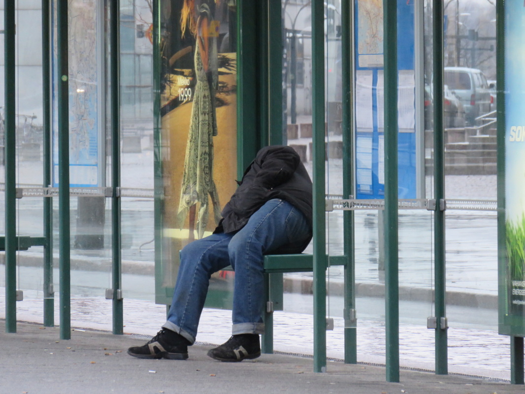 passed out tram stop advertisement city street photography